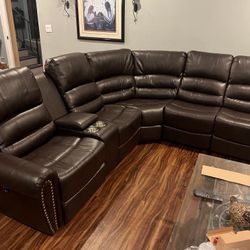 New Reclining Sectional.  Brown Or Black Leather.  111” X 98”.  Free Delivery!