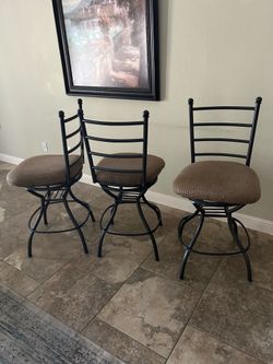 SET OF 5 iron SWIVEL BAR STOOLS 75.00 for ALL