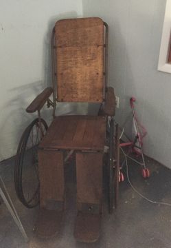 Antique wheel chair bed