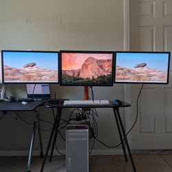 Three 24" Dell monitors and Desktop Mount
