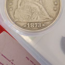 1873 SEATED LIBERTY DOLLAR