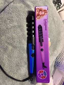 New in box curling iron