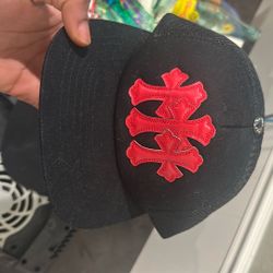 Chrome Hearts Cemetery Trucker Hat in a black and red colorway.