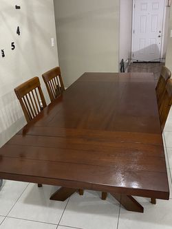 Kraven Dark Hazelnut/mahogany Dining Table.