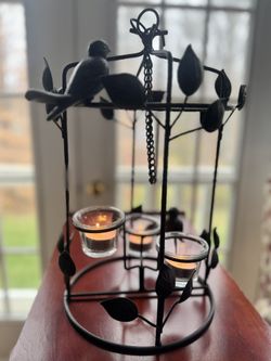 Black metal hanging bird and candle lantern