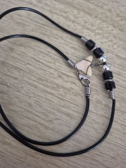 This corded shark tooth and necklace