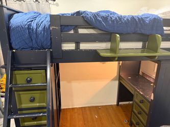 Navy blue and green bunk bed with desk