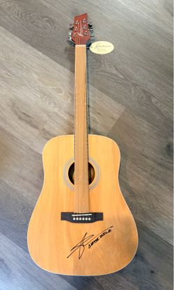 Brand new Kona guitar…signed by Chase Rice