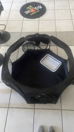 Small black kitten play pen