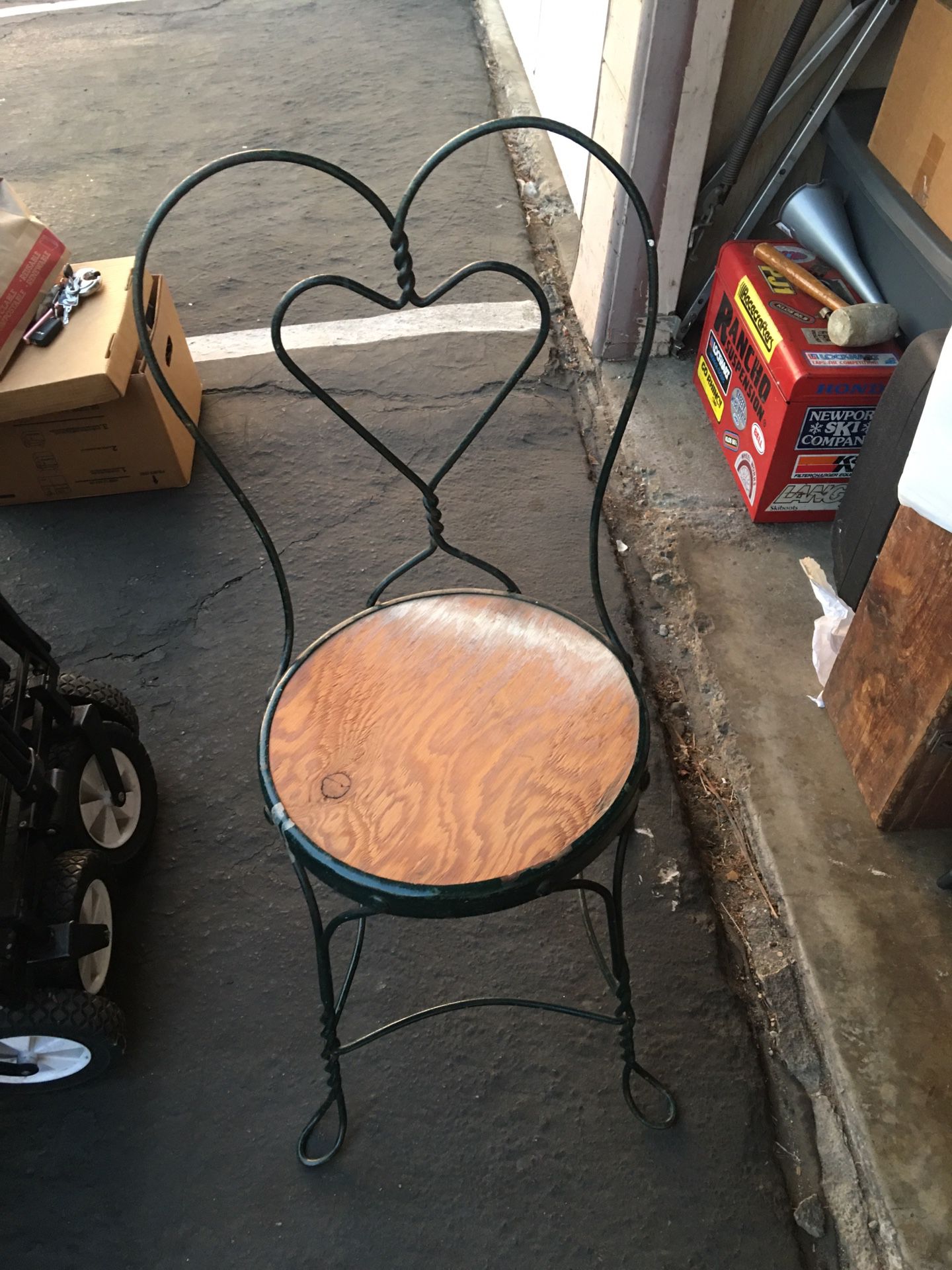 Cute vintage iron chair with the heart backing