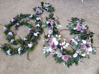 2 Artificial Flower Garland wreaths for table decor

Condition is used twice

Measurement of each arrangement left to right
Longest: 134 Inches long a