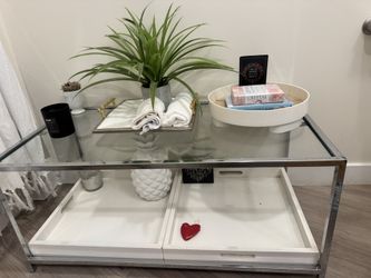 Glass coffee table with pull out white trays 