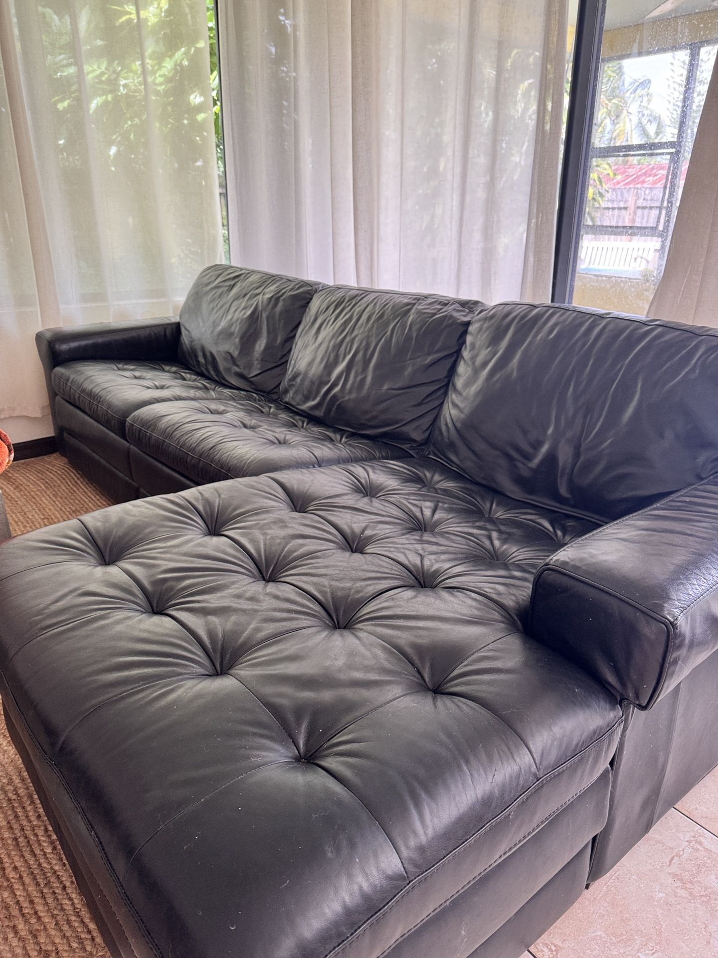 Black Leather Sofa – $350