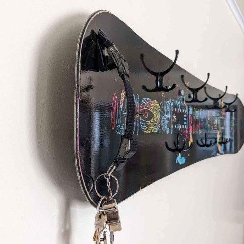 Rome Gang Plank 155cm snowboard turned into a unique wall mounted hat and coat rack