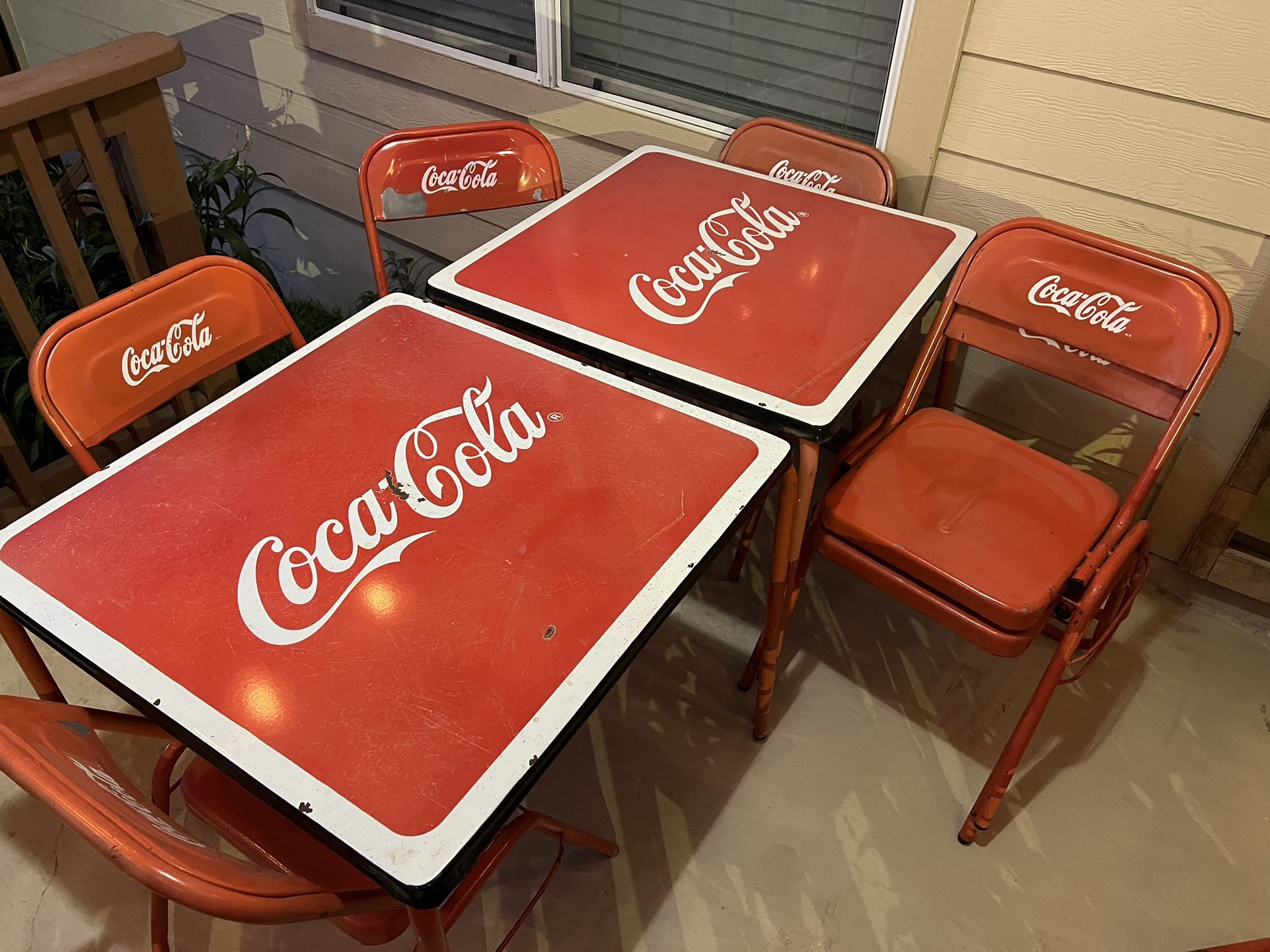 2 Coca Cola Tables and 8 antique chairs