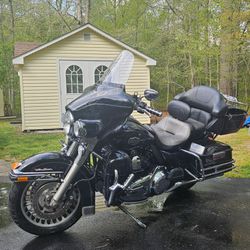 2011 Harley Davidson Ultra Classic Black Motorcycle with Vance & Hines Pipes, Upgraded Air Clear and All LED Lights. Garage kept and well maintained. 