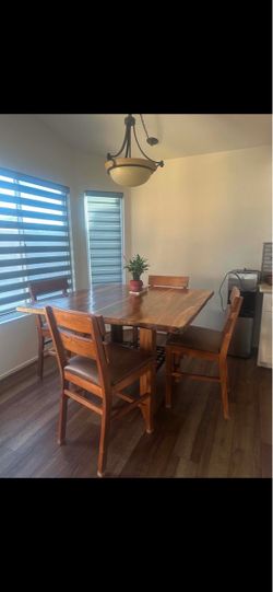 Real wood Brazilian teak dining table with 4 chairs.