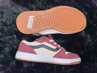 these are Vans low-top suede sneakers (pink/cream with gum sole).