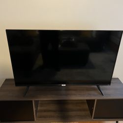 Smart Tv And Entertainment Stand