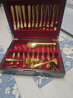 Gold flatware set with storage case