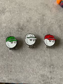 Malbon golf ball markers and hat clips