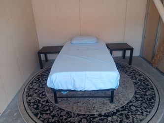 Twin bed with 2 end tables set.