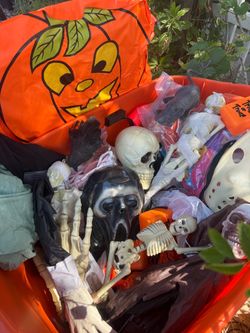 Box full of Halloween decor and mask