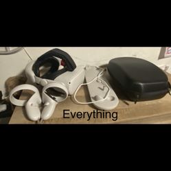 Oculus Quest 2 + Comfort Head Strap+ Charging Station+ Portable Case.