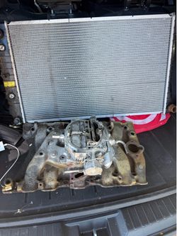 Oldsmobile cutlass intake manifold carburetor