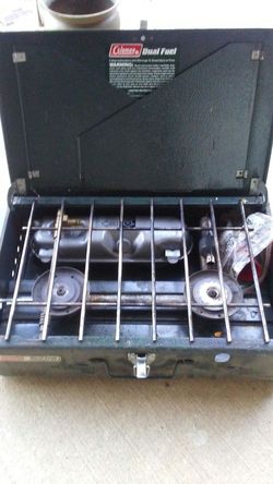 Coleman dual fuel camping stove with 2 cans of fuel