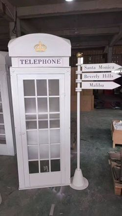 UK Traditional Phone Booth with Vintage Audio Phone and Street Sign