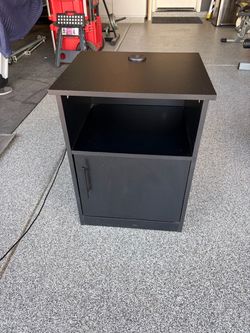 Black bedside table with charging port