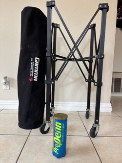 Gamma tennis ball hopper and 17 cans of new tennis pro penn balls