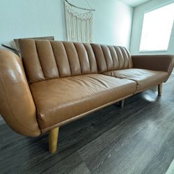 Novogratz Brittany 82 Inch Futon Sofa Bed in Faux Leather, Upholstered Couch Sleeper with Tufted Back, Mid-Century Modern Design, Brown