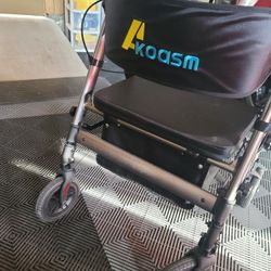 Heavy-duty Grey rollator walker with a seat, which converts to a transport chair.