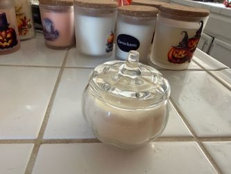 Small pumpkins glass jar and candle seasonal scents