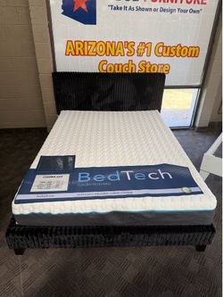 Black upholstered queen bed frame