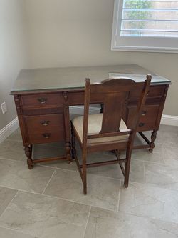 Antique desk with glass top and matching chair