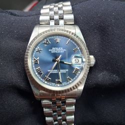 ROLEX  OYSTER PERPETUAL DATE JUST ROMAN BLUE DIAL 31MM STAINLESS STEEL W/WHITE GOLD