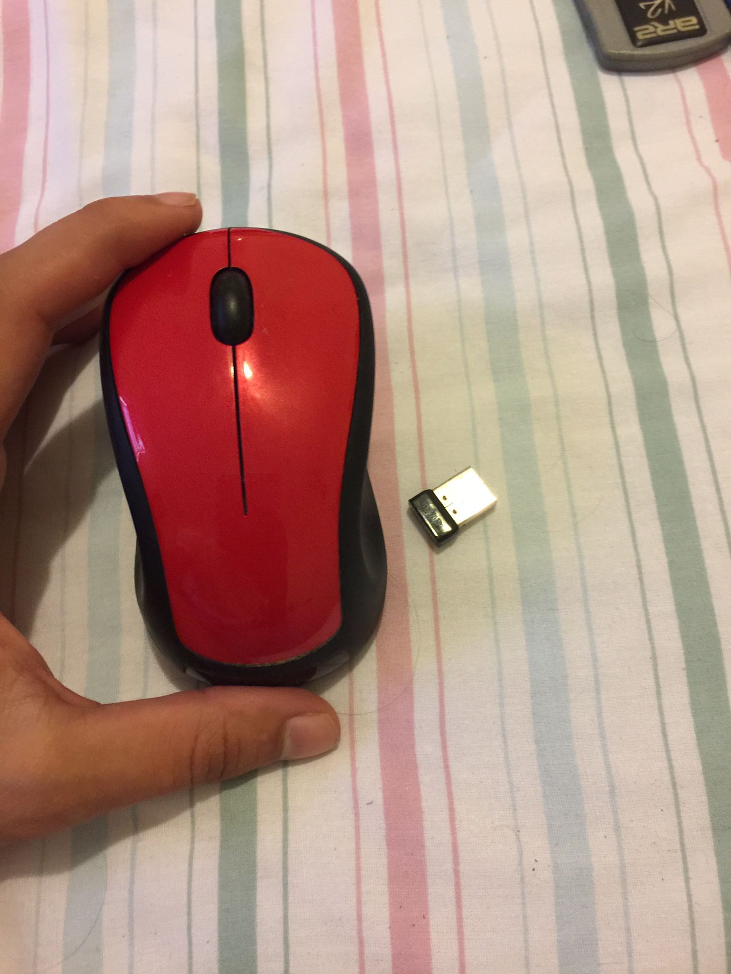 Red wireless Logitech mouse