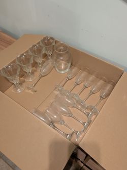 Assorted mason jars, wine glasses and other glasswatre