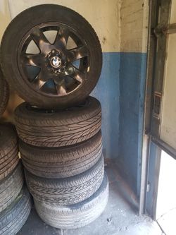 Sold as is 2003 BMW 325 rims with tires 5 pieces