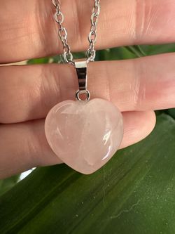 New, beautiful Rose Quartz Crystal heart necklace. Shipping available.