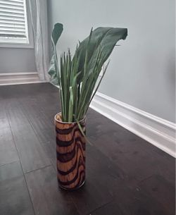 Brown vase with greenery