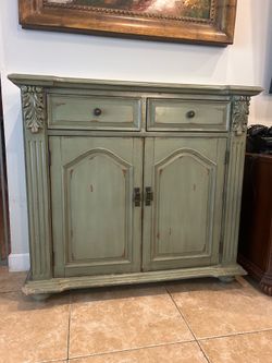Distressed Green Wood Cabinet with Carved Details