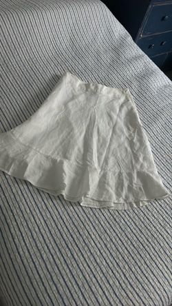 Cute women’s white skirt with ruffle at the bottom