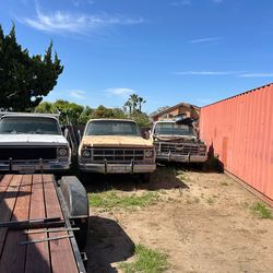 Three Chevy square body pick ups ranging from 73 to 79