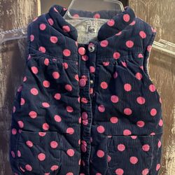 Navy blue fleece lined vest with pink polka dots. Carter’s. No flaws size 24 mo