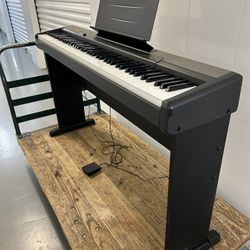Casio CDP-100 88 Key Digital Piano, Keyboard Stand, Power Supply, Music Rest and Sustain Pedal