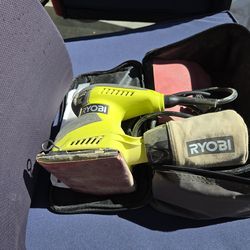 Sander with dust bag and sand papers